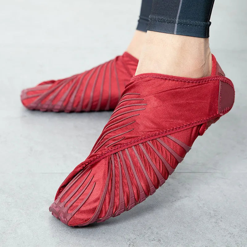Unisex dance fitness shoes with elastic waterproof upper, red colour, on studio floor