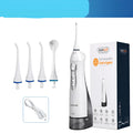 Portable white oral irrigator with large water tank, four nozzles, and a USB charging cable.