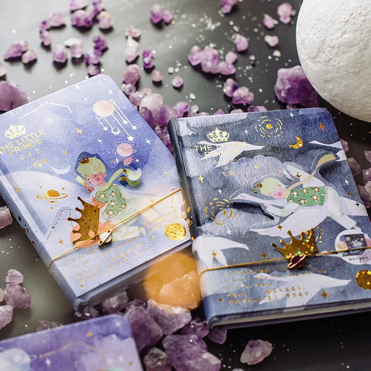 Hardback art notebook with The Little Prince cartoon cover designs showing sunset, bird, rose, and fox illustrations