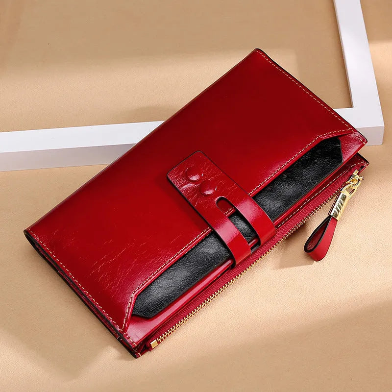 Retro-style women's leather wallet in horizontal square shape with buckle closure and multiple card slots