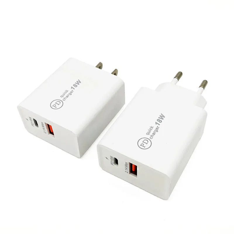 White 18W USB-C fast wall charger with bare metal US plug prongs isolated on white background