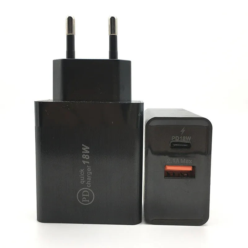 White 18W USB-C fast wall charger with bare metal US plug prongs isolated on white background