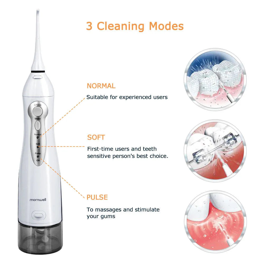 Portable white oral irrigator with large water tank, four nozzles, and a USB charging cable.