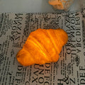 Battery-powered LED night light with simulated croissant bread design for bedroom decoration