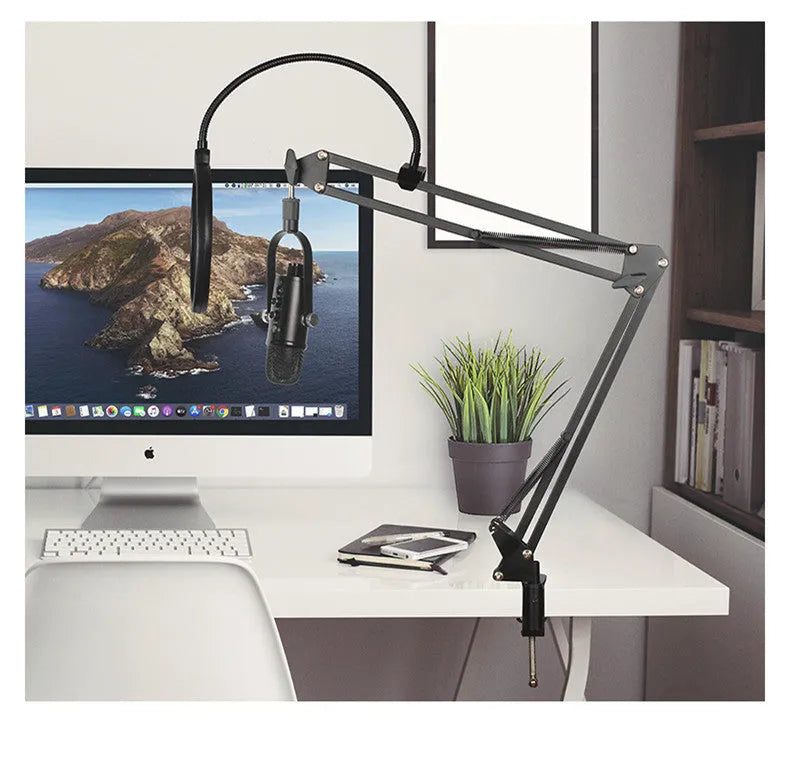 Black JIY BM-86PRO USB condenser microphone on a metal stand with sponge cover.