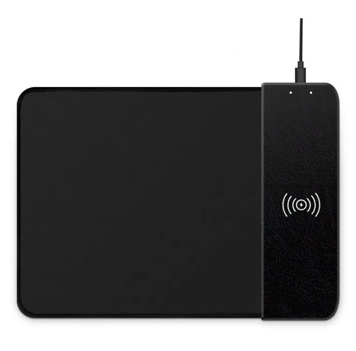 Black wireless charging mouse pad with RGB edge lighting on a desk.