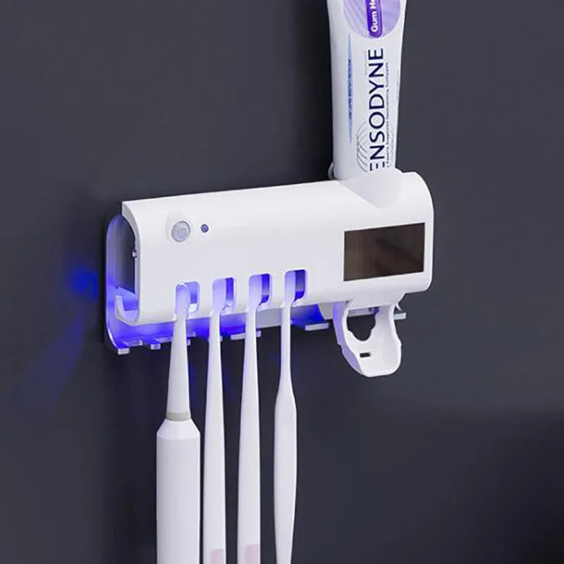 Black wall-mounted UV toothbrush steriliser with automatic toothpaste squeezer and solar panel