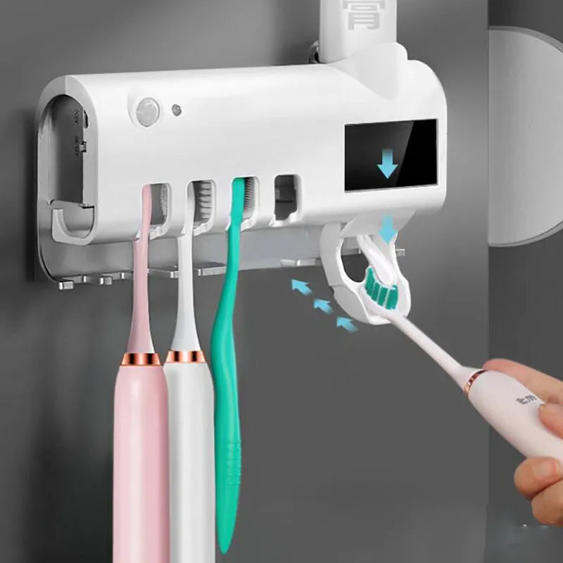 Black wall-mounted UV toothbrush steriliser with automatic toothpaste squeezer and solar panel