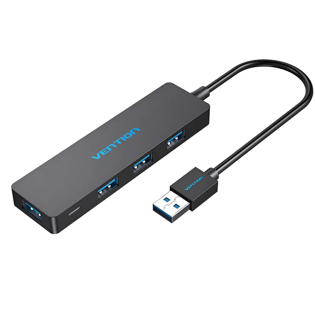 Black four-port USB 3.0 hub with a short connected cable on a desk