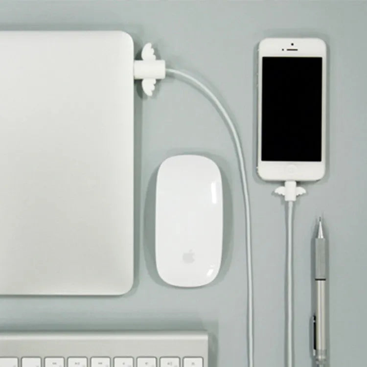 White angel and black bat style silicone protective covers for mobile phone charging cables.