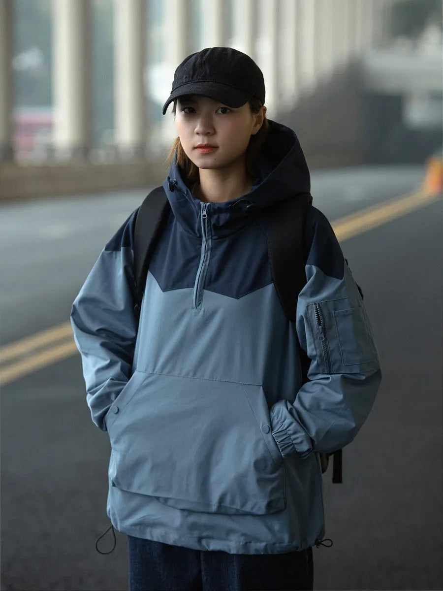 Color matching tooling hooded pullover jacket for men and women in light blue with zipper closure and loose fit