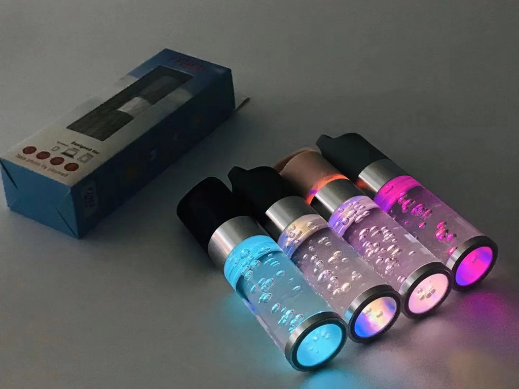 Compact rectangular Bluetooth speaker with crystal-effect LED lighting in pink colour, showing dimensions.