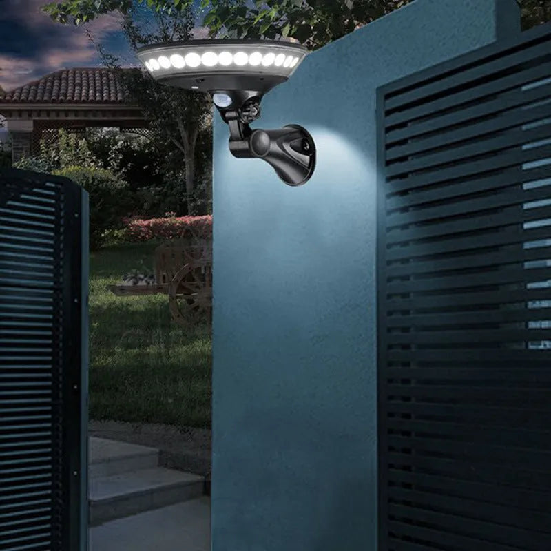 White 360-degree solar garden light with motion sensor for outdoor wall or path installation