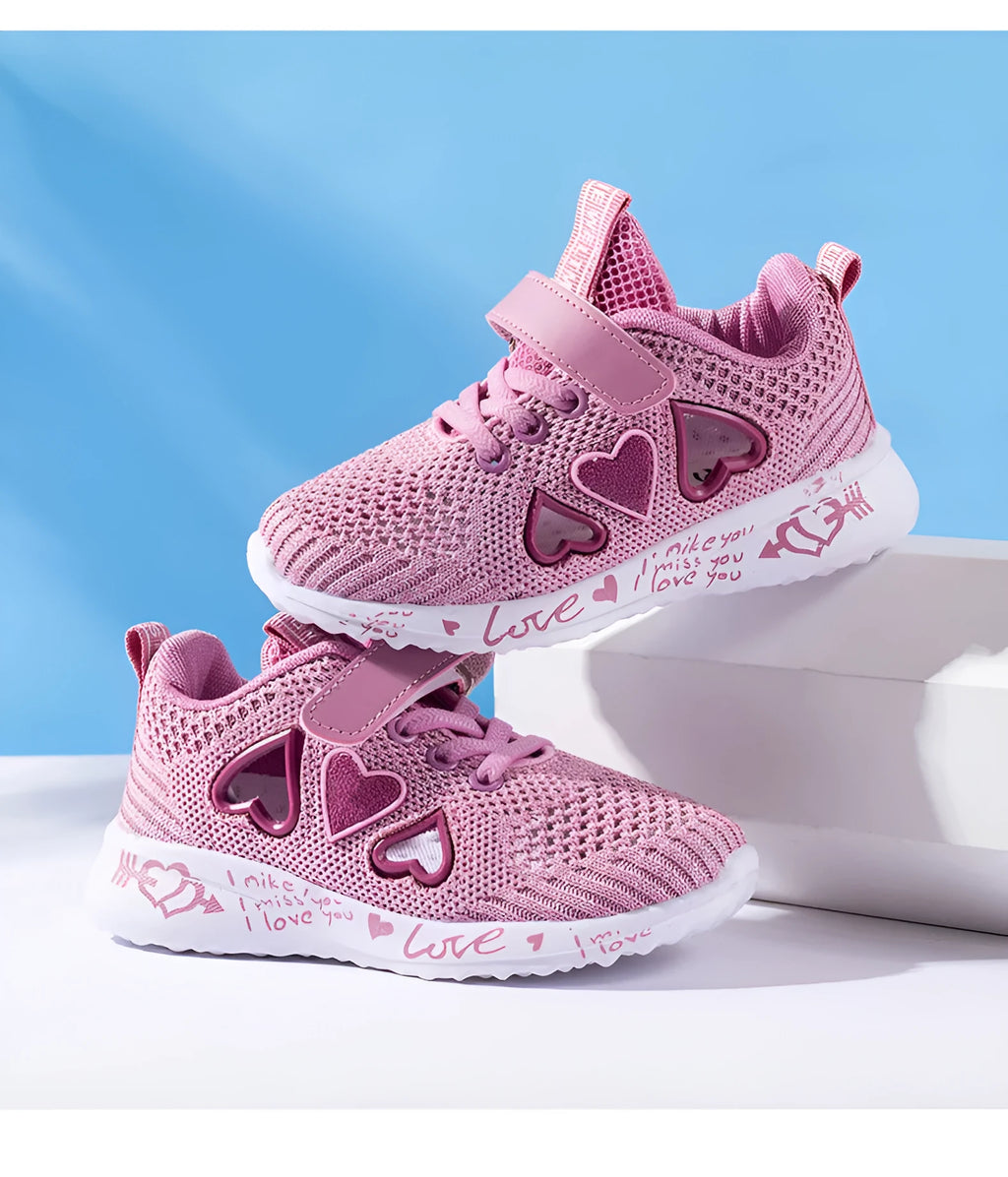 Kids pink and purple mesh sneakers with Velcro straps and hand-painted cartoon design on a white background.