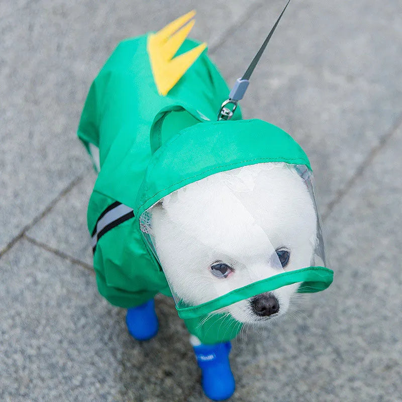 Small dog wearing a yellow bear upgrade polyester taffeta raincoat, standing on grass, a practical two-legged casual style for autumn walks