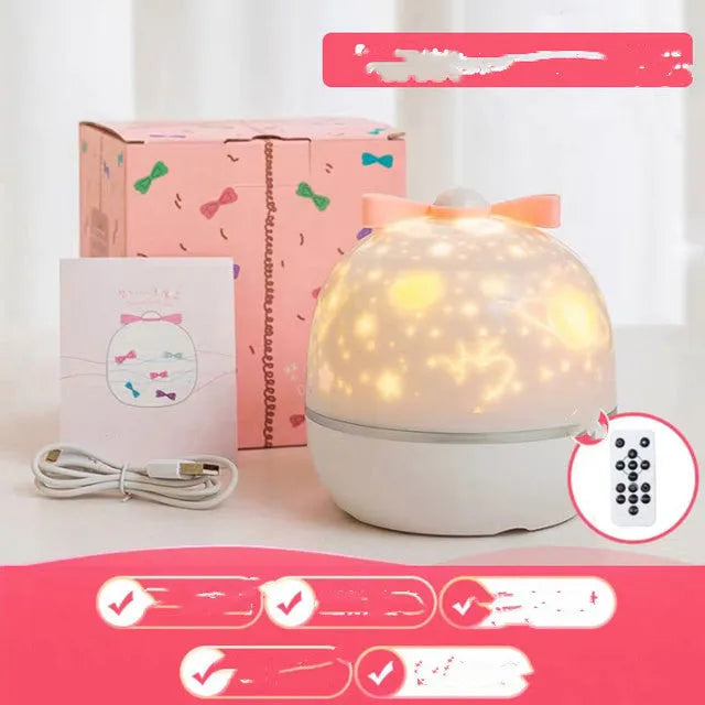 Rechargeable rotating star projector light projecting coloured celestial patterns on wall