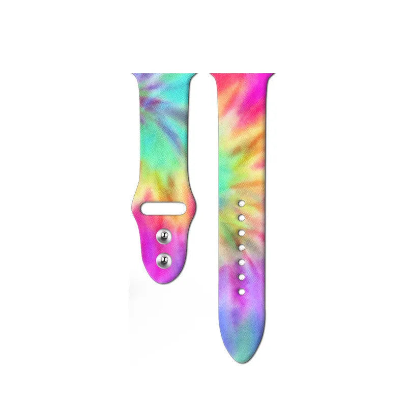 Silicone Apple Watch band in a tie-dye pattern showing the adjustable strap and connector.