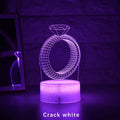 3D LED night light projecting a colourful diamond ring stereogram on a black base with touch control.