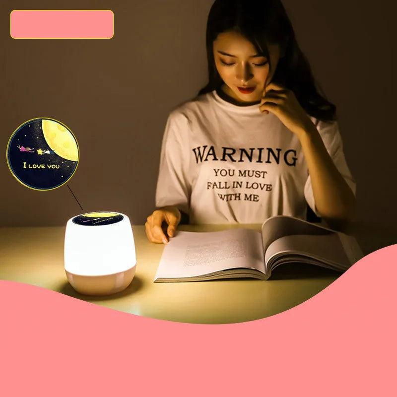 Pruixin rotating LED projector night light displaying star and moon patterns on a wall.