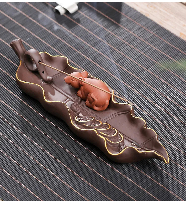 Purple clay ceramic lying incense burner with golden rat design