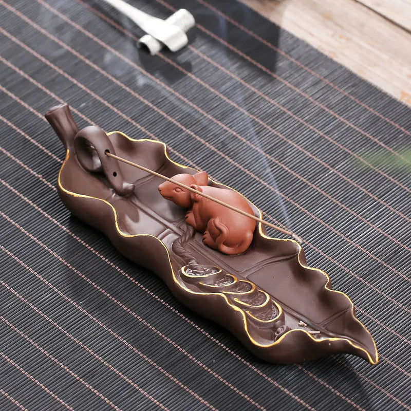 Purple clay ceramic lying incense burner with golden rat design