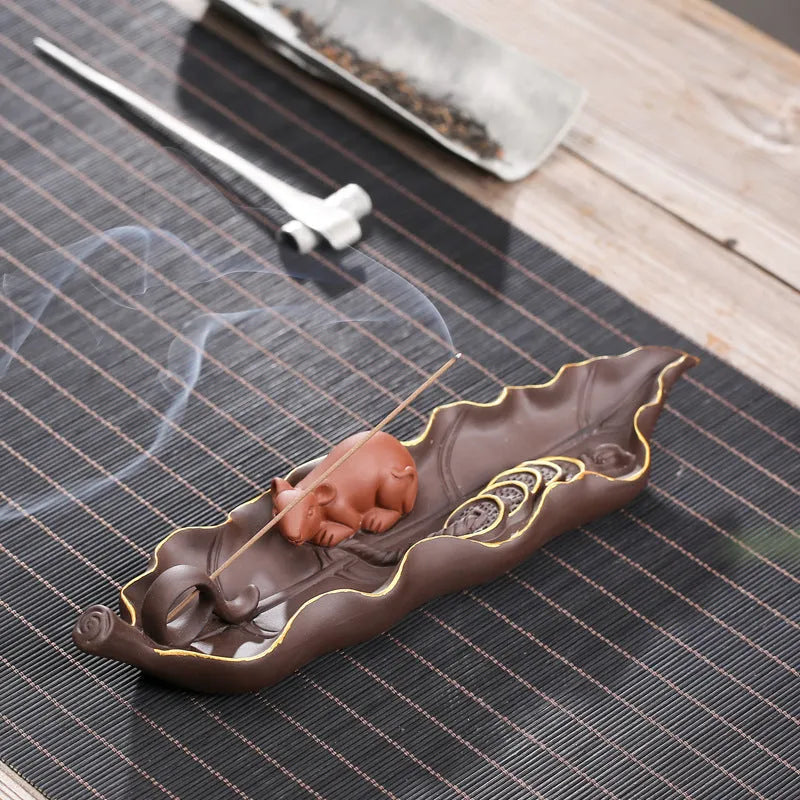 Purple clay ceramic lying incense burner with golden rat design