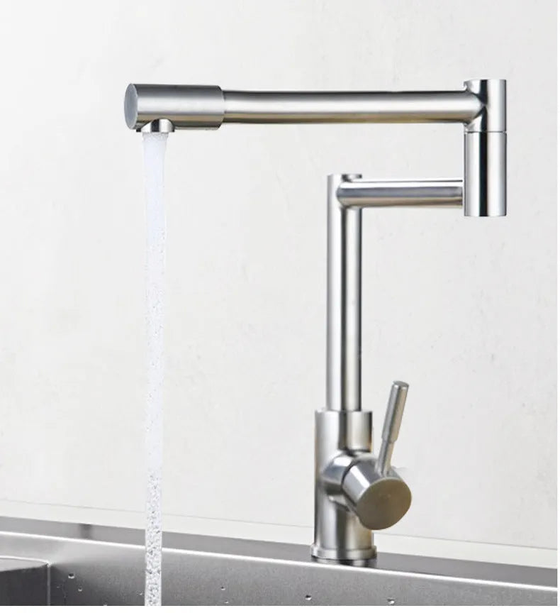 Silver stainless steel kitchen mixing tap with rotating spout and dual hot cold controls