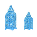 Pair of blue geometric metal wall sconces with tea light, showing Moroccan-style openwork design.