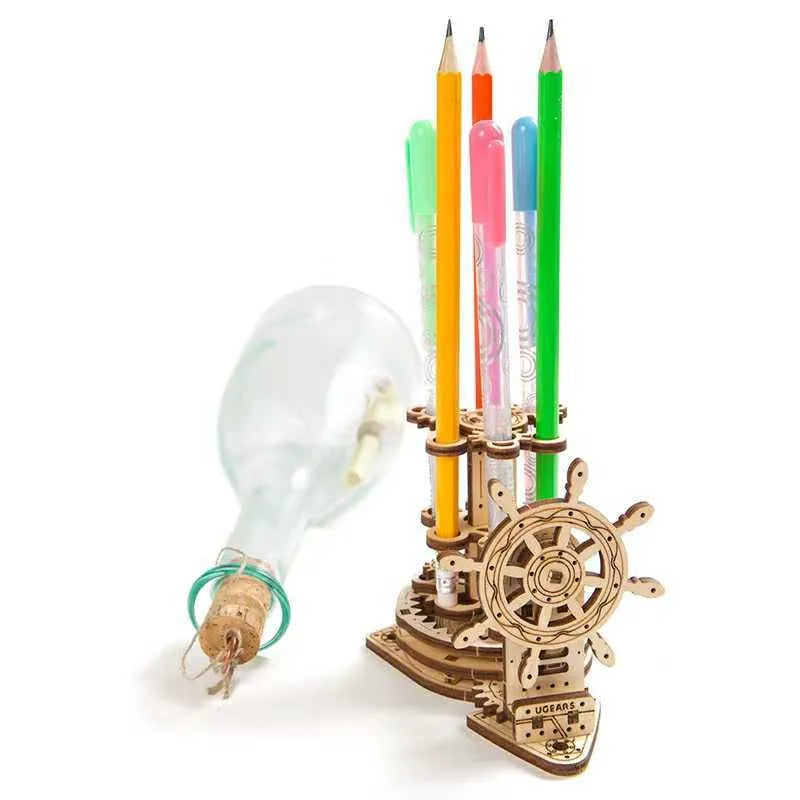 Ukrainian wooden rotating pen holder with steering wheel mechanism on a desk, holding coloured pencils