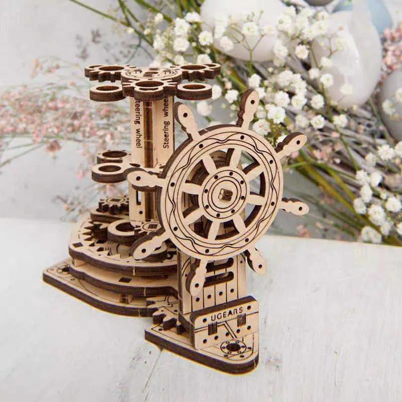 Ukrainian wooden rotating pen holder with steering wheel mechanism on a desk, holding coloured pencils