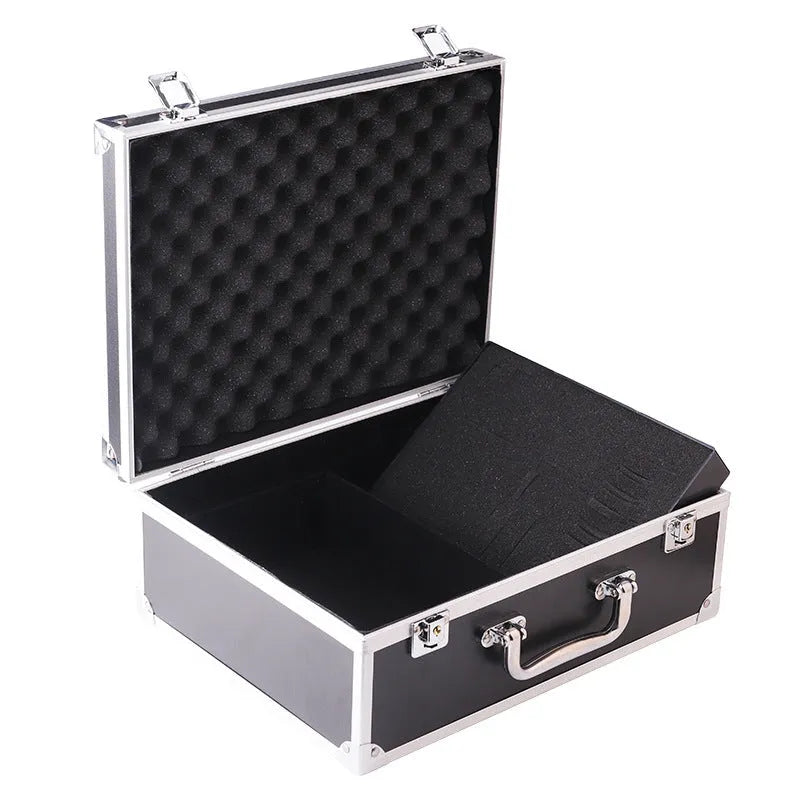 Black aluminium tattoo equipment storage box open, showing foam compartments for machine and supplies.
