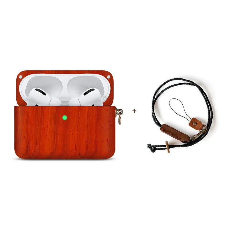 Solid wood Bluetooth earphone sleeve in walnut finish with attached black lanyard, next to wireless earphones.