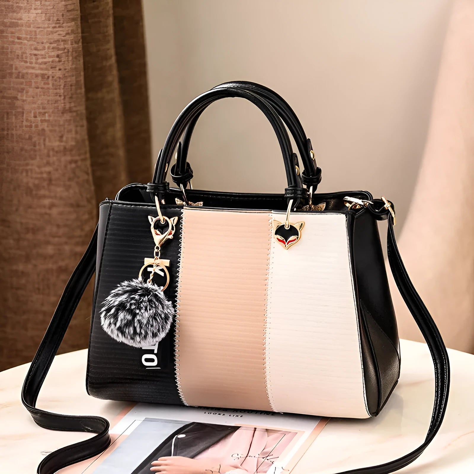 European American fashion shoulder handbag in PU with soft handle and multiple inner pockets.