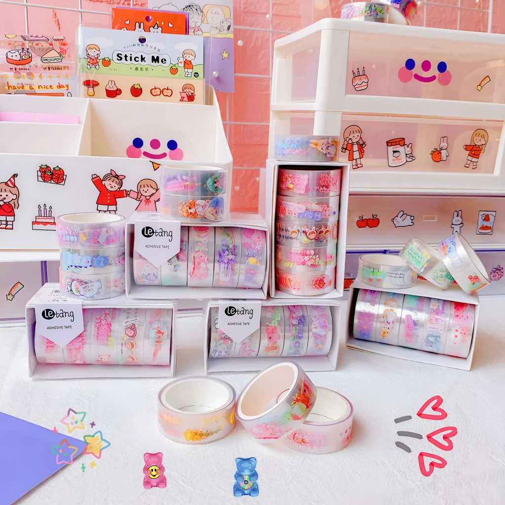 Five rolls of cartoon washi tape with dinosaur, duck, lucky cat, and rabbit designs.