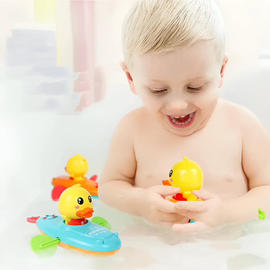 Yellow plastic wind-up swimming bath toy for children's water play activities