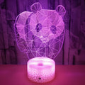 Panda colorful LED touch 3D night light with seven colour modes and remote control on a table