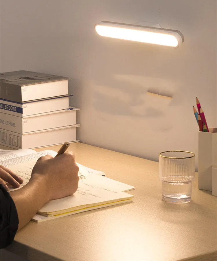 Baseus magnetic LED desk lamp hanging on a wardrobe rail, white, with touch switch and USB port