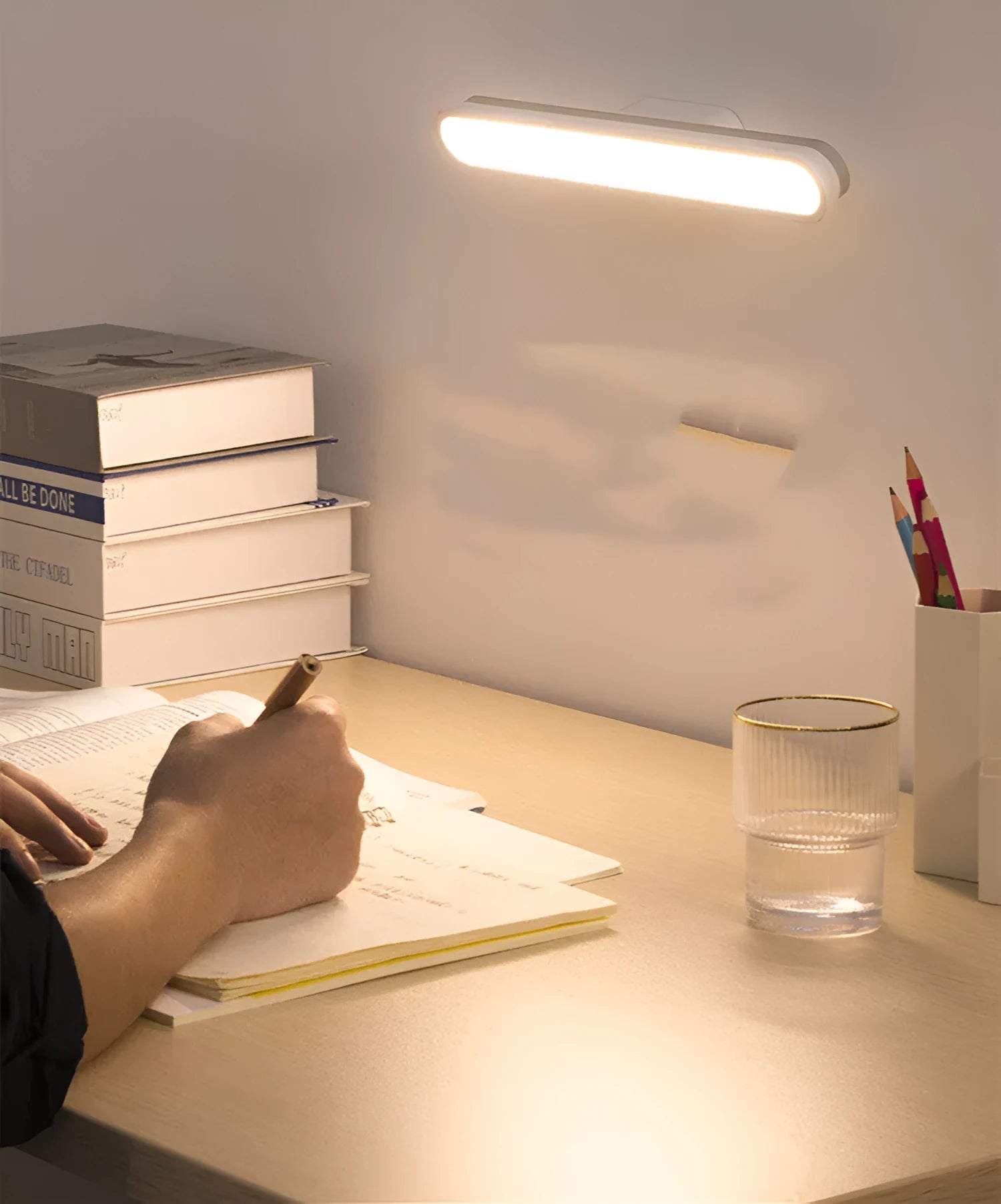 Baseus magnetic LED desk lamp hanging on a wardrobe rail, white, with touch switch and USB port