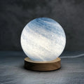 Nordic style table lamp with glass shade in multiple colours, featuring a USB charging port and button switch.