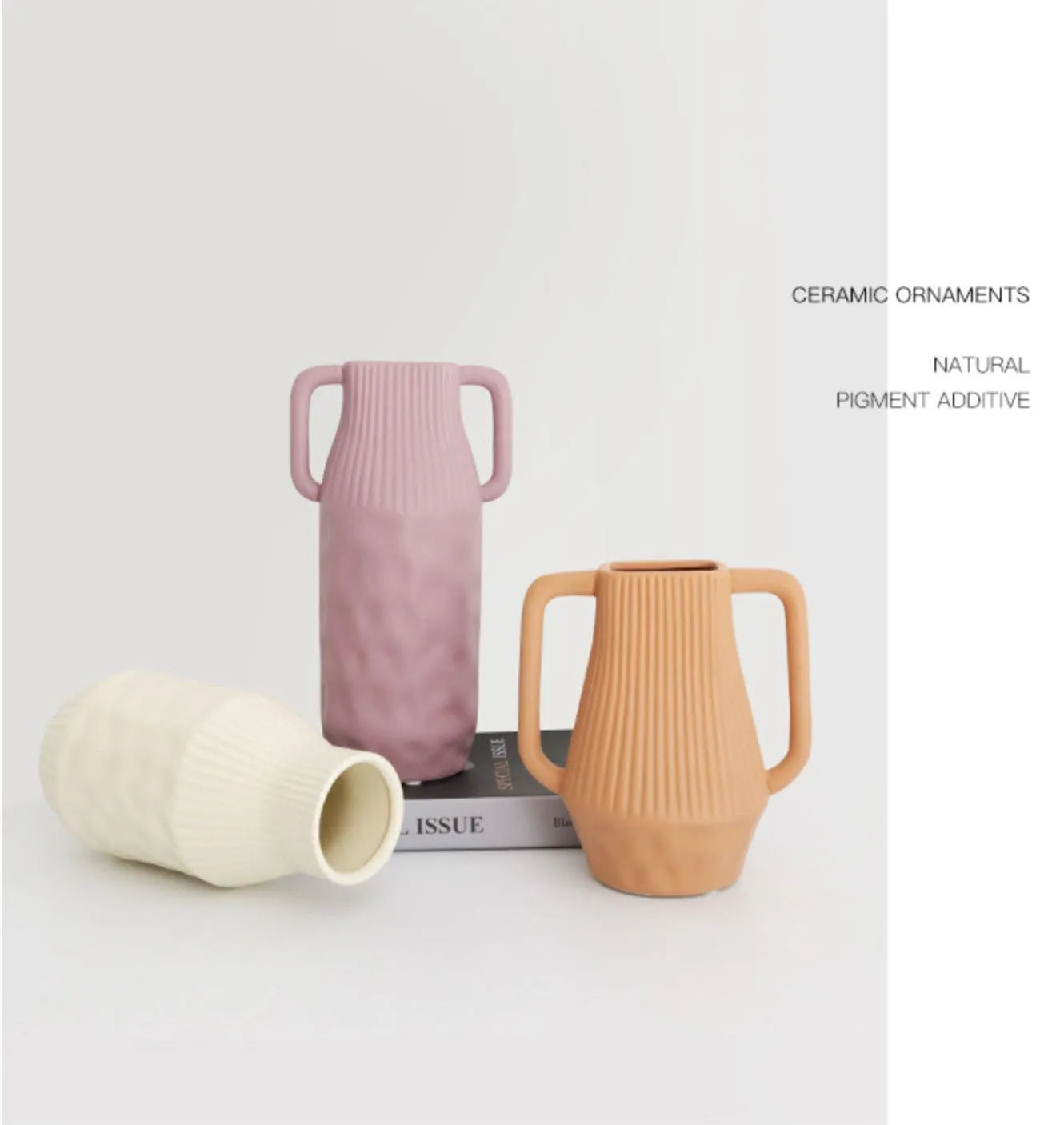 Morandi coloured ceramic vase with hammered glaze texture on a wooden shelf.