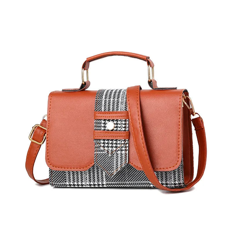 Fashion woman handbag in soft PU with shoulder strap, side view showing polyester lining