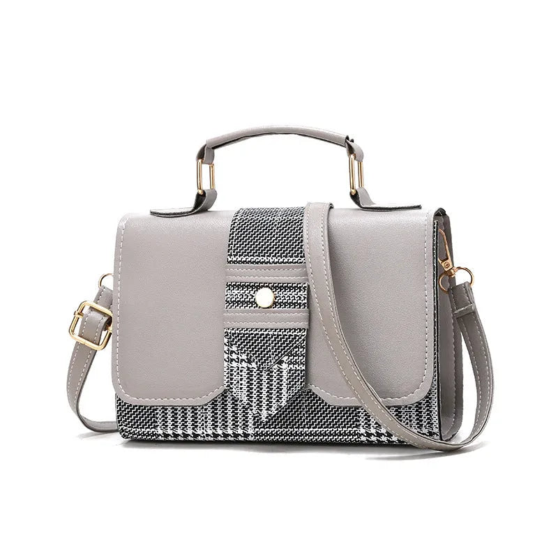 Fashion woman handbag in soft PU with shoulder strap, side view showing polyester lining