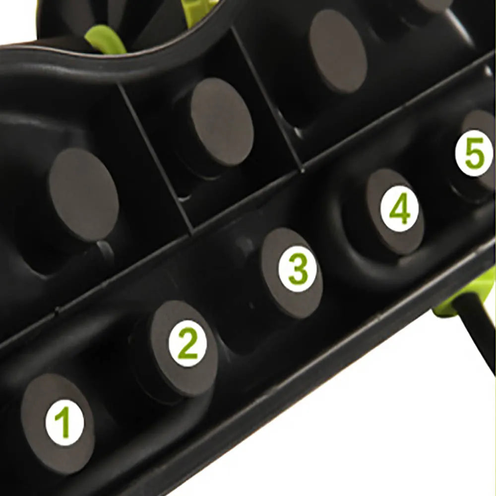Black ab roller wheel with EVA cushion on floor, showing side view of roller and handles