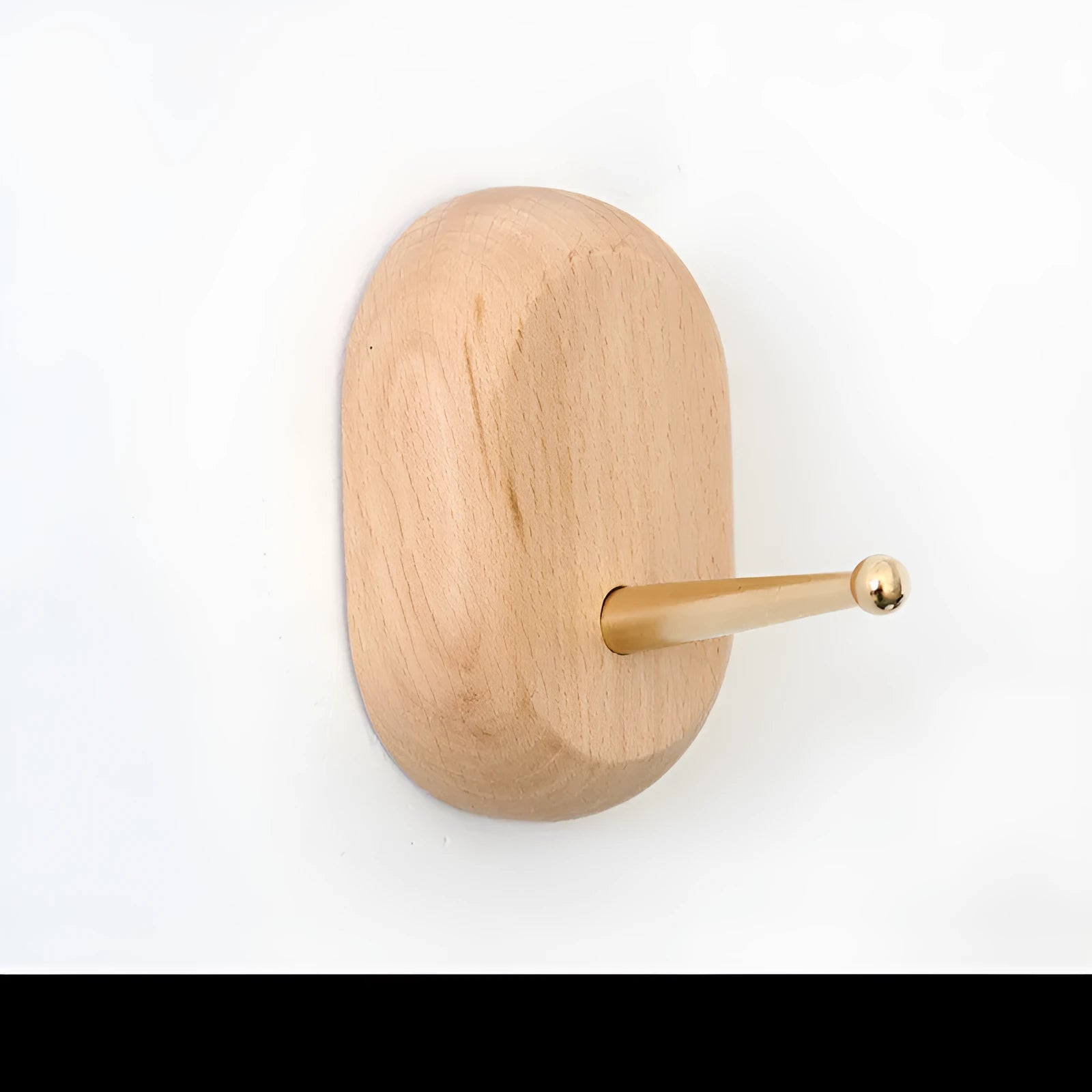 Beech wood wall hook with brass mechanism in five shapes: round, capsule, oval, diamond, and square