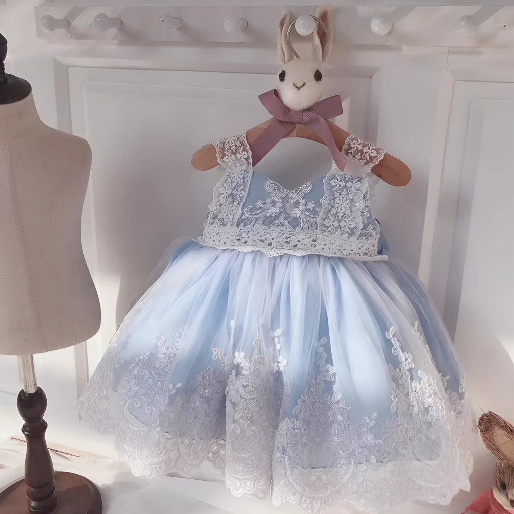 Ocean blue baby girl princess dress with lace detailing, shown on a size chart.