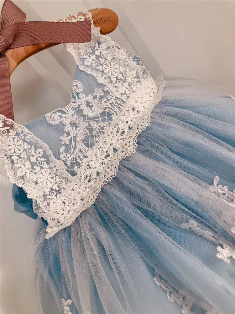 Ocean blue baby girl princess dress with lace detailing, shown on a size chart.