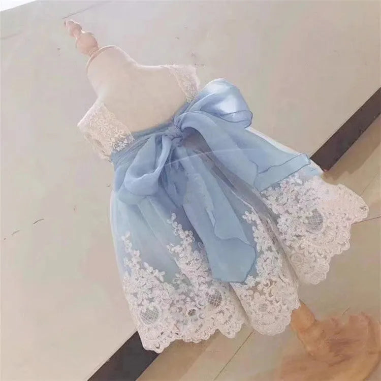 Ocean blue baby girl princess dress with lace detailing, shown on a size chart.