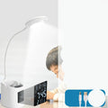 White USB-powered desk lamp with touch control on a wooden desk.