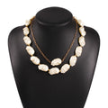 Gold irregular pearl necklace on woman clavicle chain with imitation pearls and alloy frame