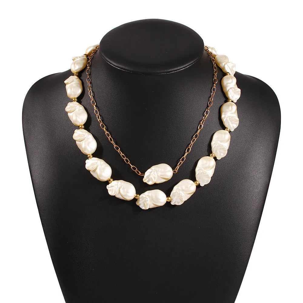Gold irregular pearl necklace on woman clavicle chain with imitation pearls and alloy frame